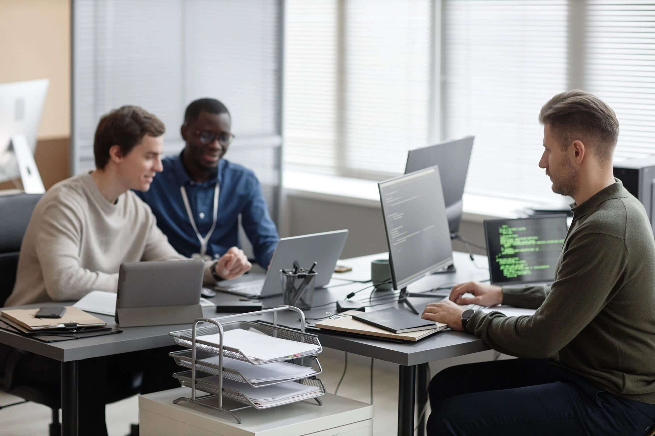 Technology professionals collaborating in a modern office