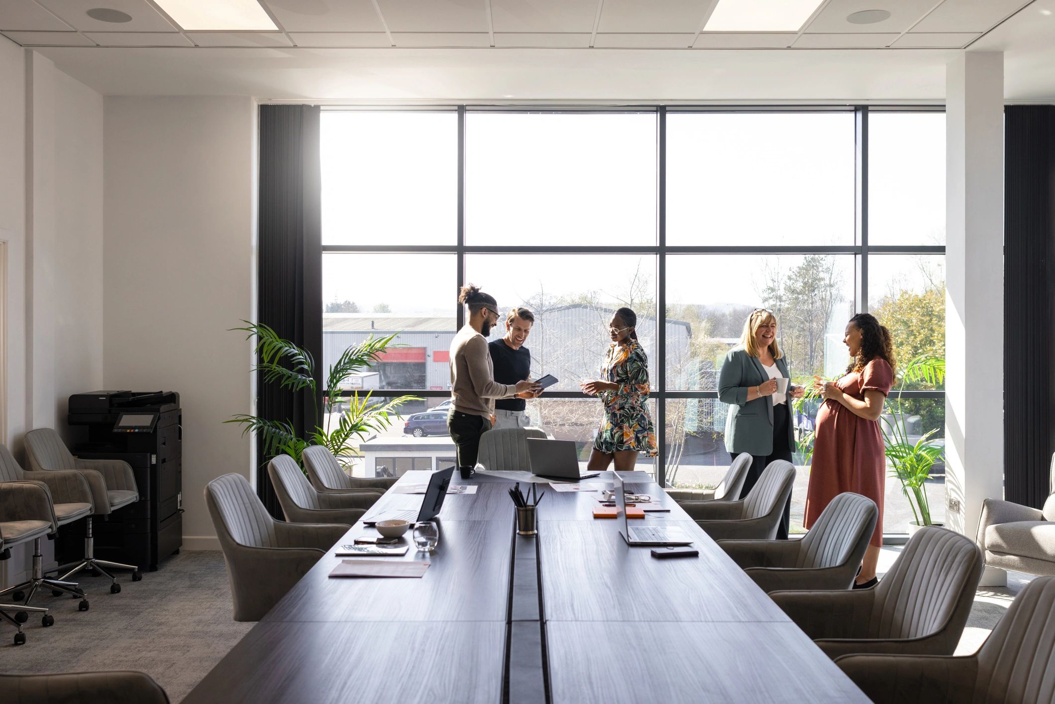 Zensys team collaborating in a modern office